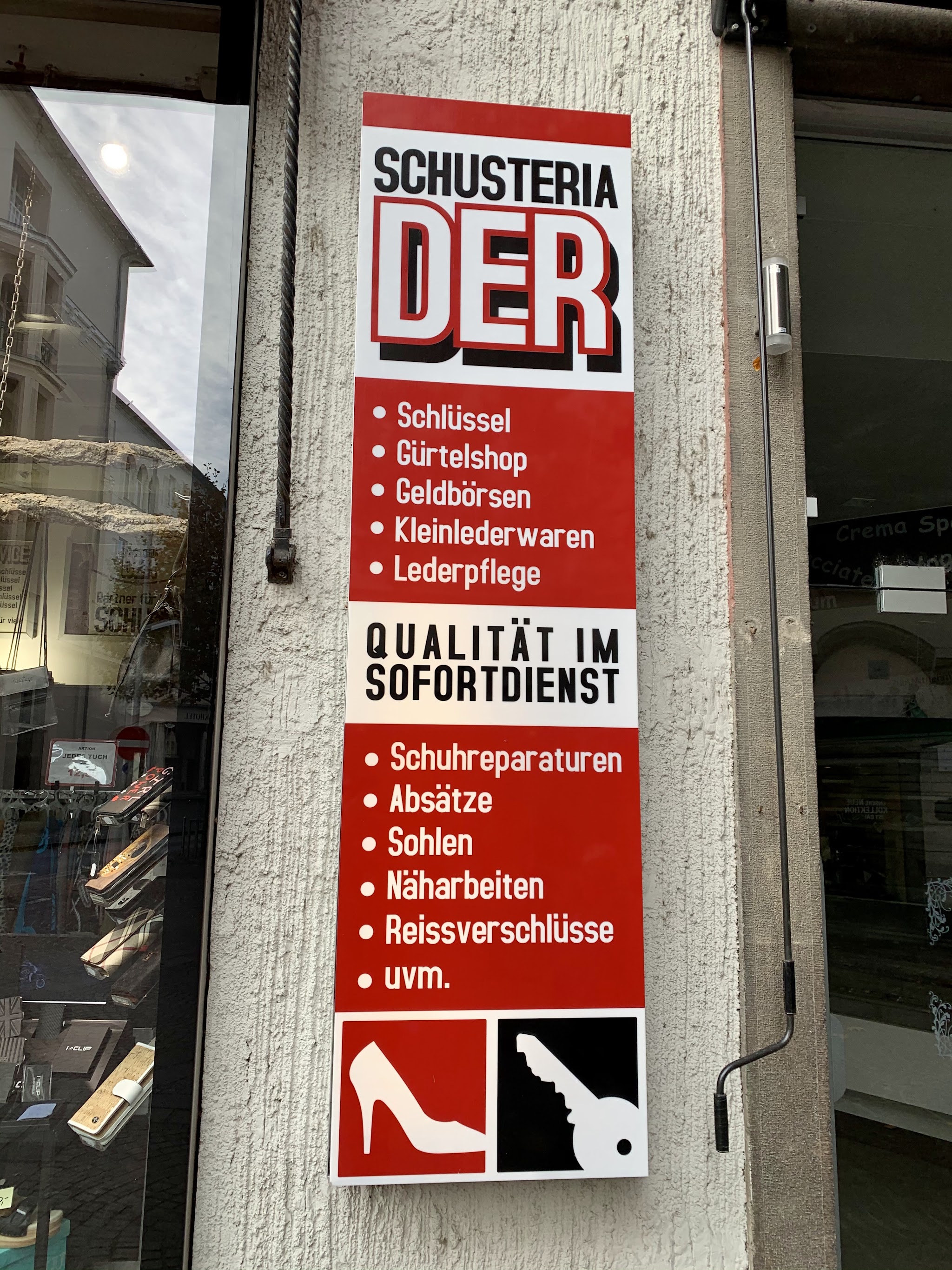 Wandschild SCHUSTERIA DER mit der vollständigen Leistungsliste